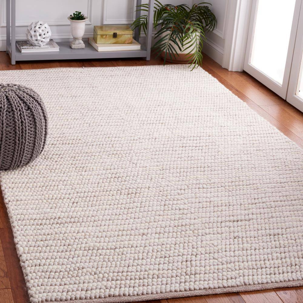 Ivory and Beige 8' x 10' Handwoven Wool and Synthetic Area Rug