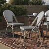 Black and white chevron outdoor dining chairs arranged around a table.