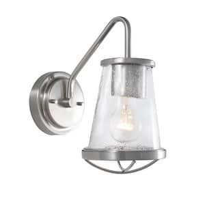 Georgina 5.75 in. 1-Light Brushed Nickel Industrial Wall Sconce with Clear Seeded Glass Shade and Cage Accent