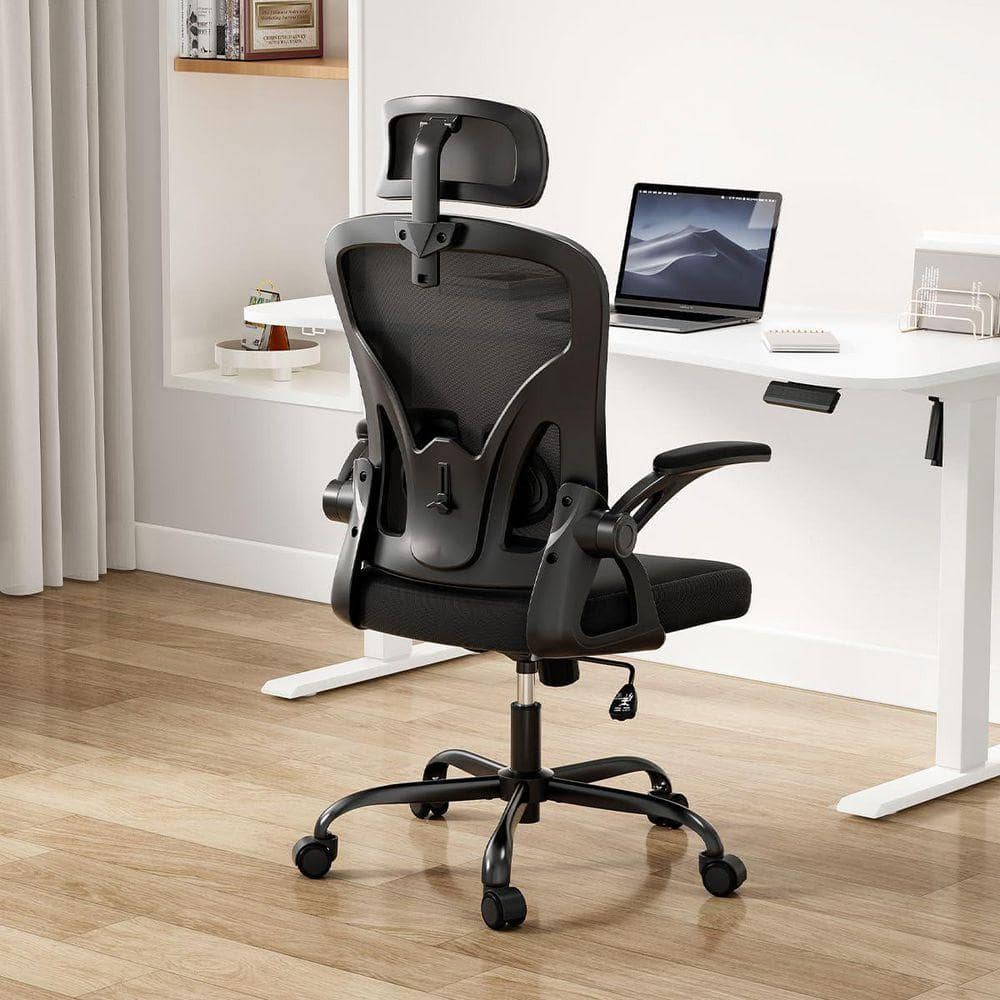 Rear view of a black mesh ergonomic task chair.