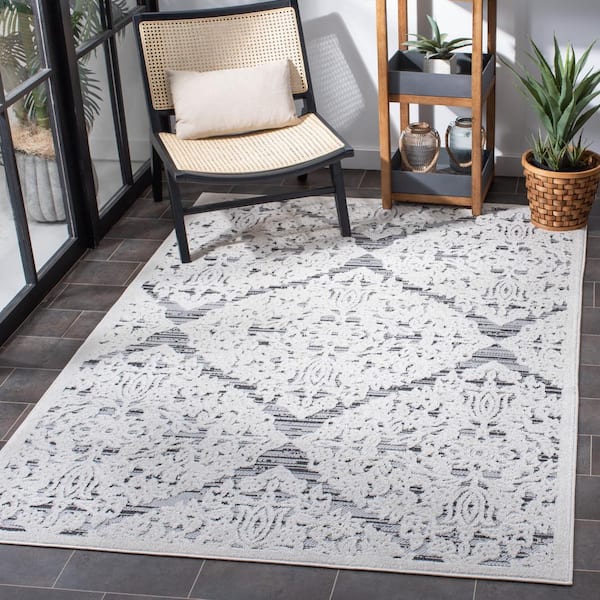 https://images.thdstatic.com/productImages/dc46a2a5-81d6-4075-9423-7baf3271ab0c/svn/ivory-gray-safavieh-outdoor-rugs-cbn660a-5-31_600.jpg