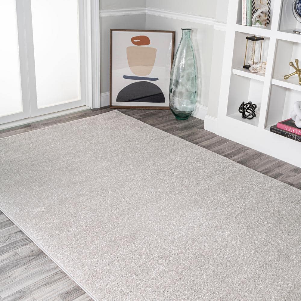 Ivory Solid Synthetic Low-Pile Rectangular Area Rug, 4' x 6'