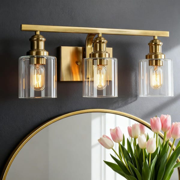 Alvra 22 in. Vintage Plated Natural Brass Bathroom Vanity Light with Clear Glass Shades, 3-Light Powder Room Wall Sconce