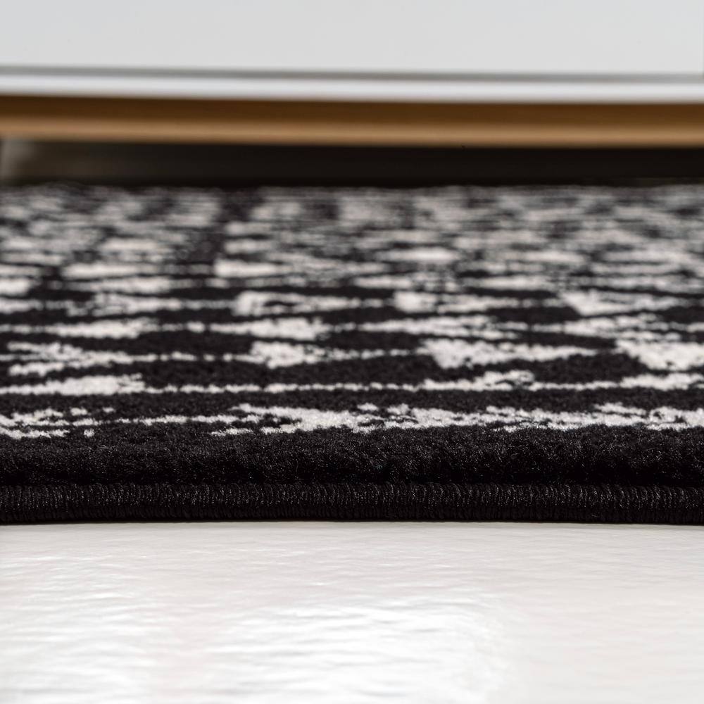 3' x 5' Black and Cream Synthetic Moroccan Geometric Area Rug