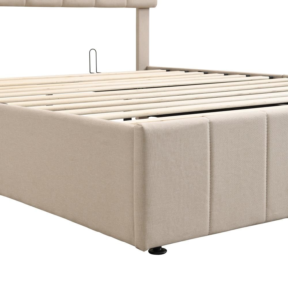 Close-up view of the beige upholstered bed frame and wooden slats.