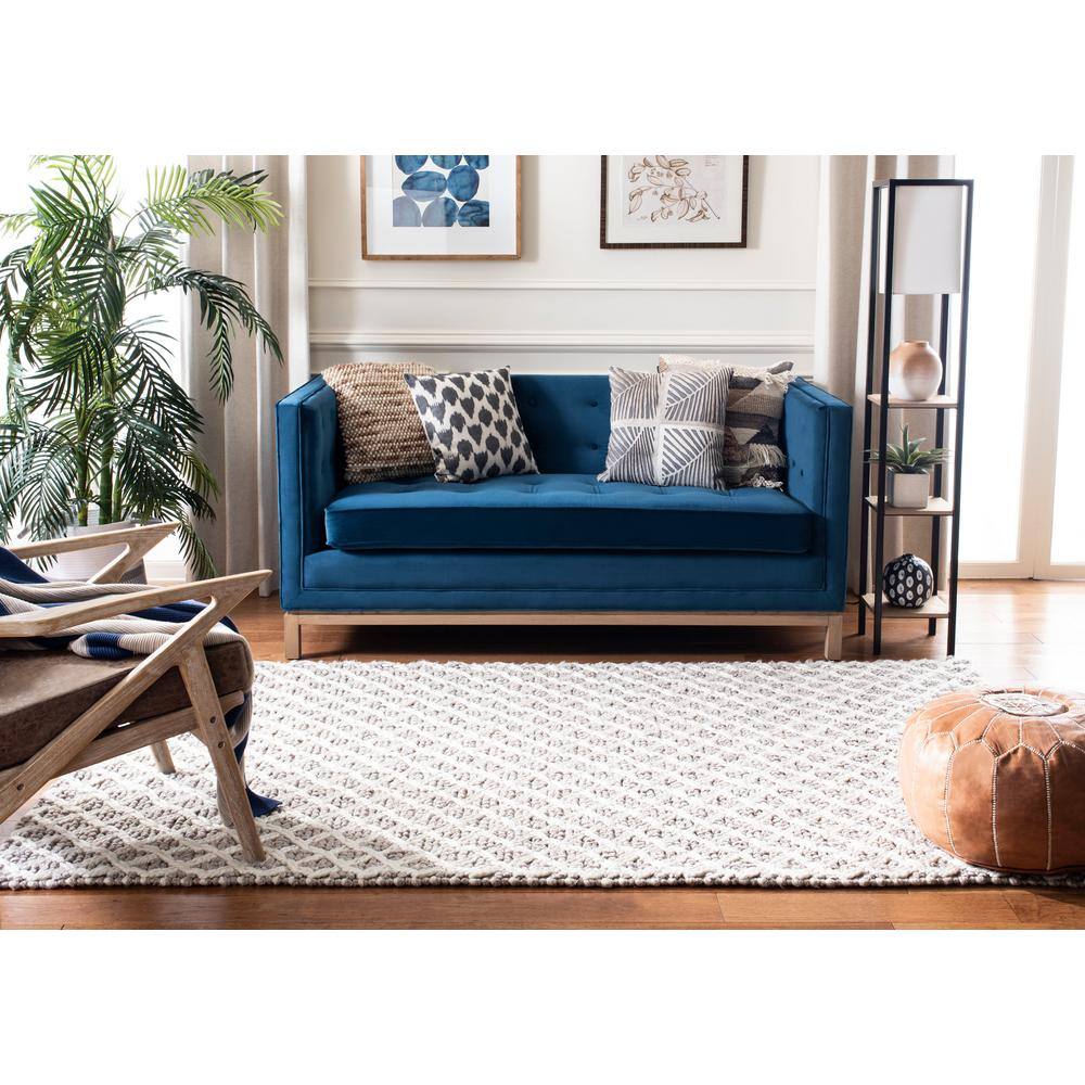 Ivory and Beige Braided Wool Area Rug, 5' x 8'