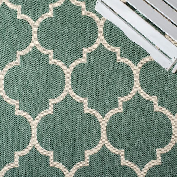 https://images.thdstatic.com/productImages/dd3dfa44-5bd8-4ffa-8fc1-959464c2e3c8/svn/dark-green-beige-safavieh-outdoor-rugs-cy6914-322-4-c3_600.jpg