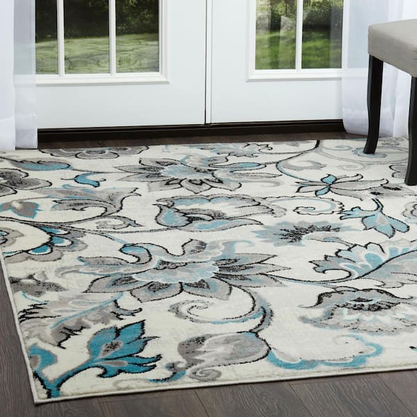 https://images.thdstatic.com/productImages/dd46fd6c-d232-4e40-a48d-ee645955fb73/svn/ivory-aqua-home-dynamix-area-rugs-2-hd6200-128-e1_600.jpg