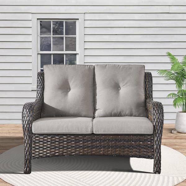 Brown PE Wicker Outdoor Loveseat with Gray Cushions and Curved Armrests