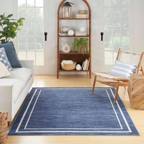 https://images.thdstatic.com/productImages/dd5e1040-28aa-5215-a230-3f9ccd151565/svn/navy-ivory-nourison-area-rugs-148742-4f_600.jpg