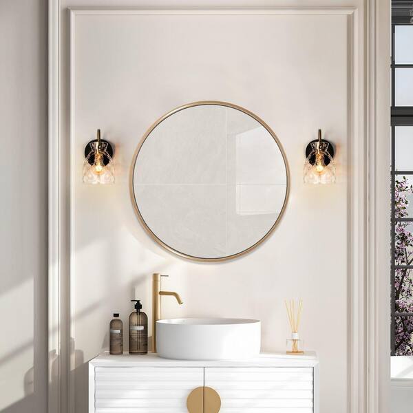 https://images.thdstatic.com/productImages/dd62533a-1720-471d-9545-a3e7143827d6/svn/black-and-brass-1-light-uolfin-vanity-lighting-v7rru3hd23911me-e1_600.jpg