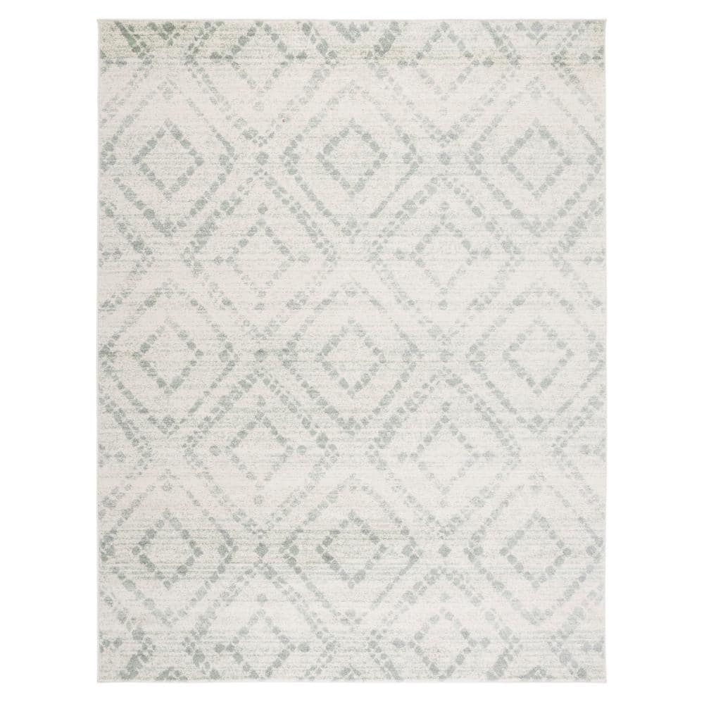 Ivory and Green Geometric 10' x 14' Synthetic Area Rug
