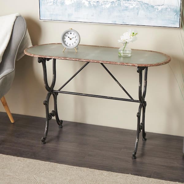 Litton Lane 45 in. Gray Large Oval Metal Console Table with Distressed Accents