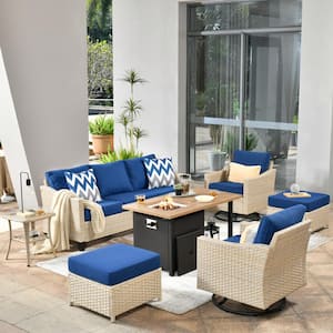 Camellia F 7-Piece Wicker Patio Storage Fire Pit Conversation Set with Swivel Rocking Chairs and Navy Blue Cushions