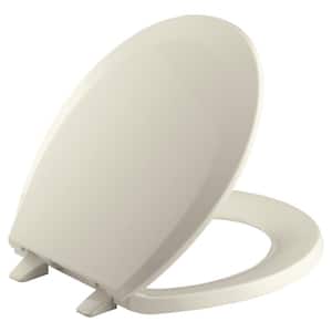 Lustra Round Closed-Front Toilet Seat with Quick-Release Hinges in Almond