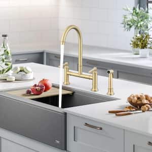 Deck Mount Double Handle Bridge Kitchen Faucet with Side Spray in Brushed Gold
