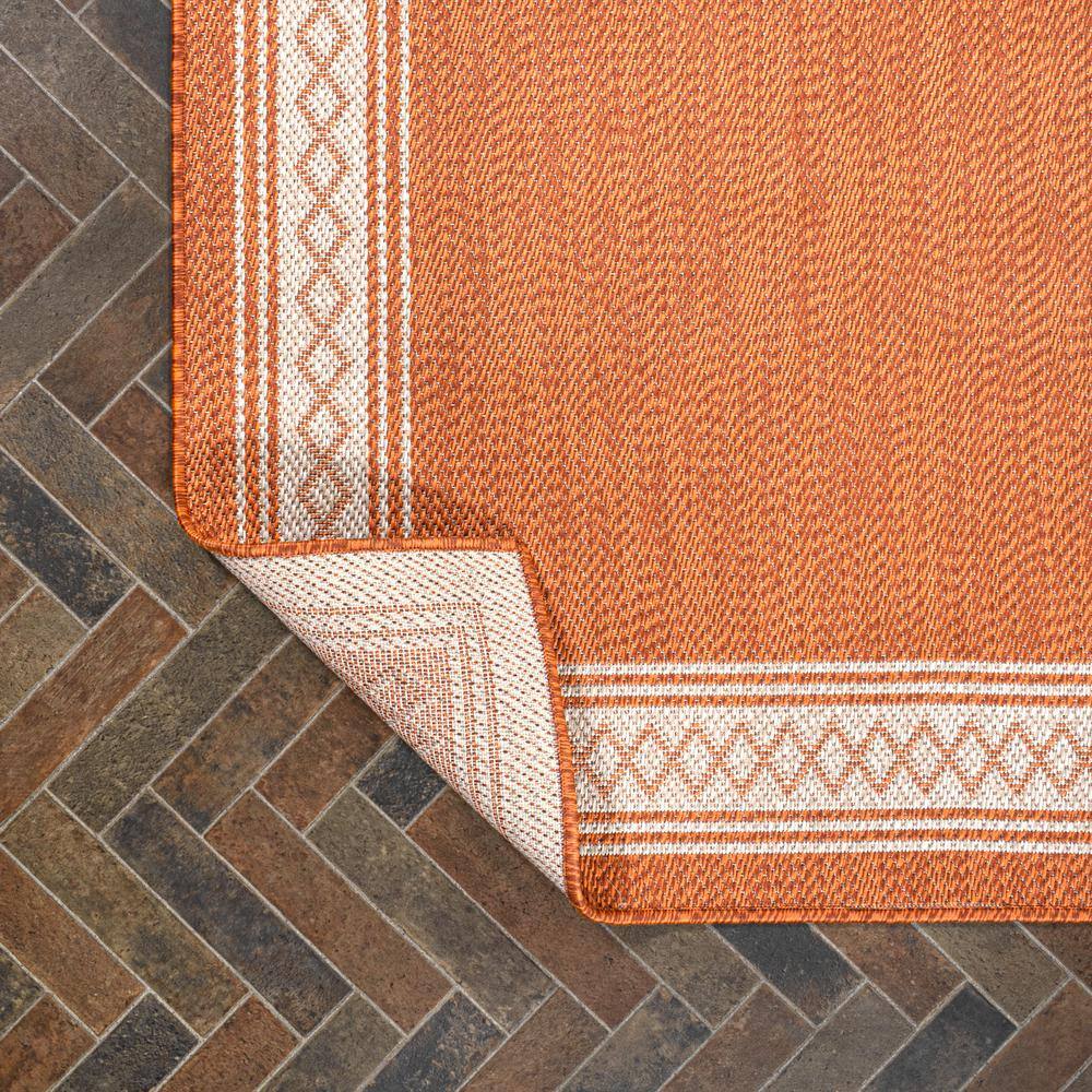 Lucia Cream and Orange Synthetic Indoor/Outdoor Area Rug