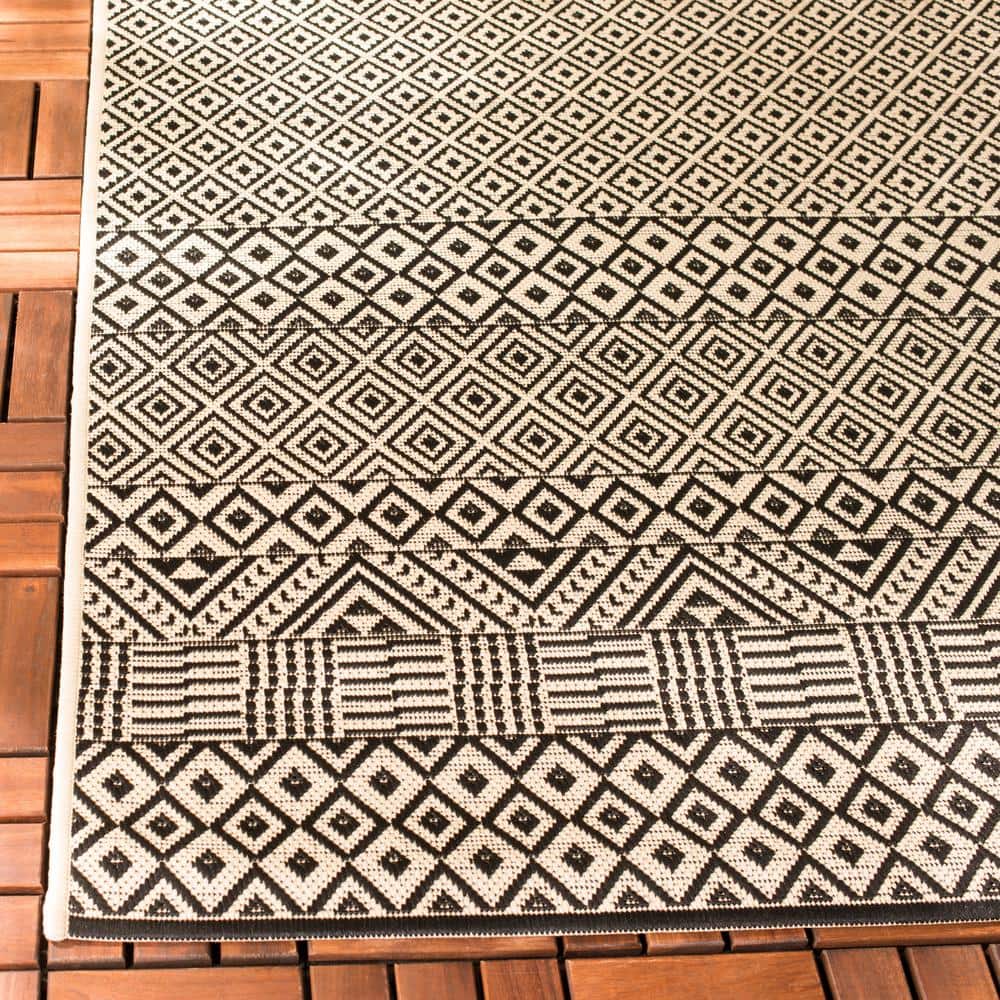 Beige and Black 9' x 12' Synthetic Flat Woven Reversible Rug