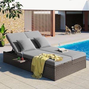 Gray Wicker Outdoor Chaise Lounge Day Bed with Dark Gray Cushions and Pillows