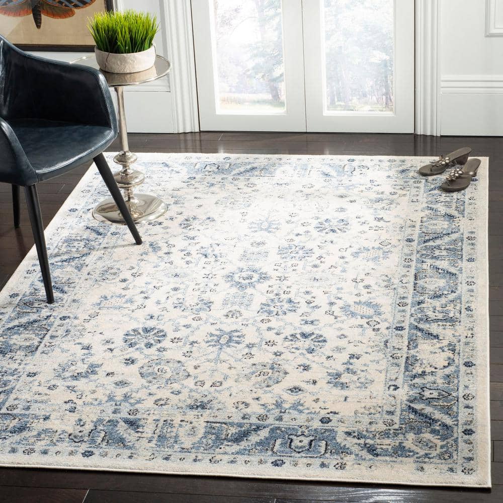 Ivory and Blue 4' x 6' Synthetic Rectangular Area Rug
