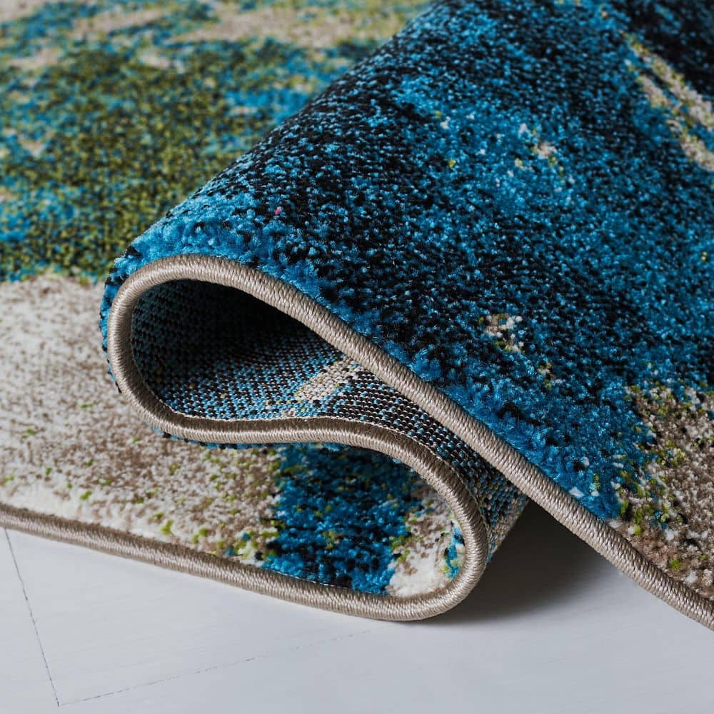 Navy and Green Abstract 4' x 6' Synthetic Area Rug