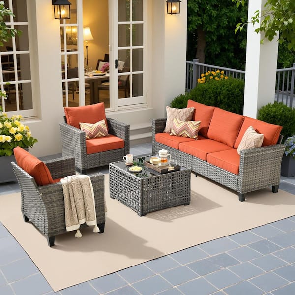 Scarlet 4-Piece Wicker Outdoor Furniture Patio Conversation Sofa Set with a Solar Lighted Table and Orange Red Cushions