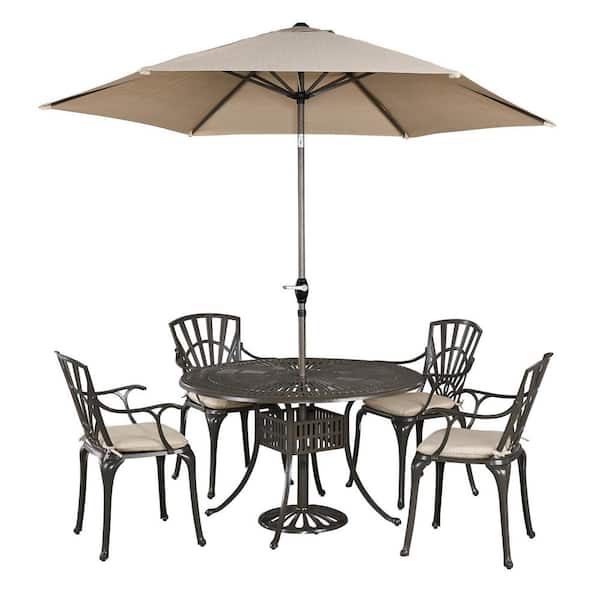 HOMESTYLES Grenada Taupe Tan 48 in. 5-Piece Cast Aluminum Round Outdoor Dining Set with Umbrella with Tan Cushions