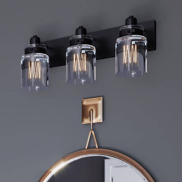 Calhoun Collection 21-5/8 in. 3-Light Antique Bronze Clear Glass Farmhouse Urban Industrial Bathroom Vanity Light