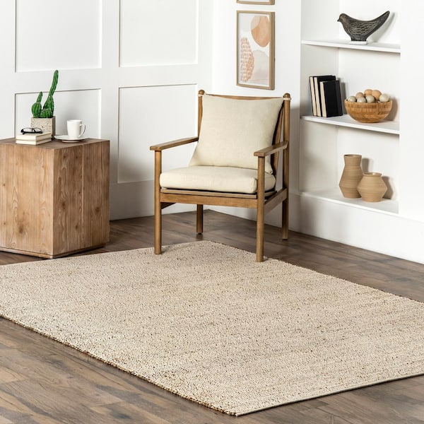 Elfriede Solid Jute Natural 9 ft. x 12 ft. Tan Low Traffic Living Room/Bedroom/Dining Room Area Rug