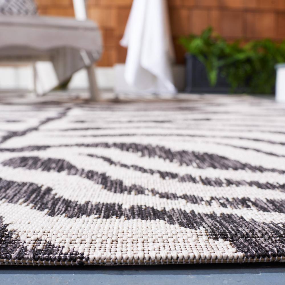 Ivory and Black Zebra Print Indoor/Outdoor Area Rug