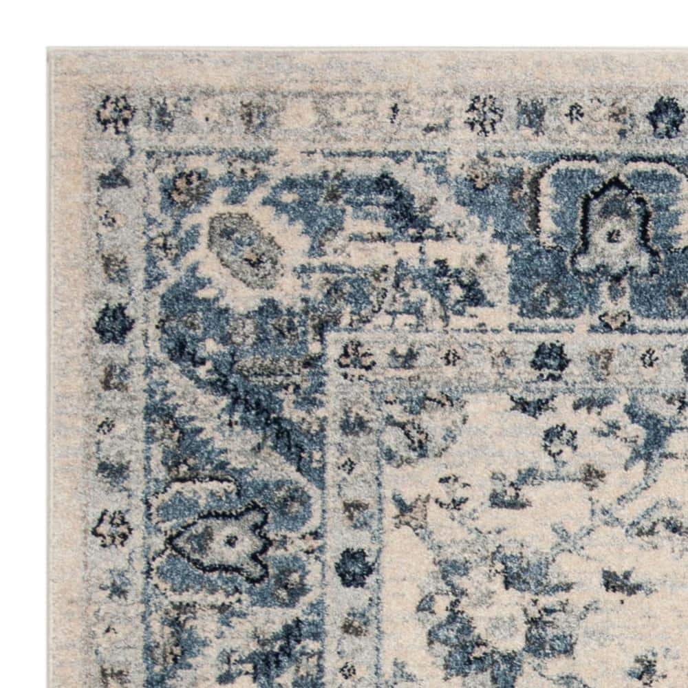 Ivory and Blue 4' x 6' Synthetic Rectangular Area Rug