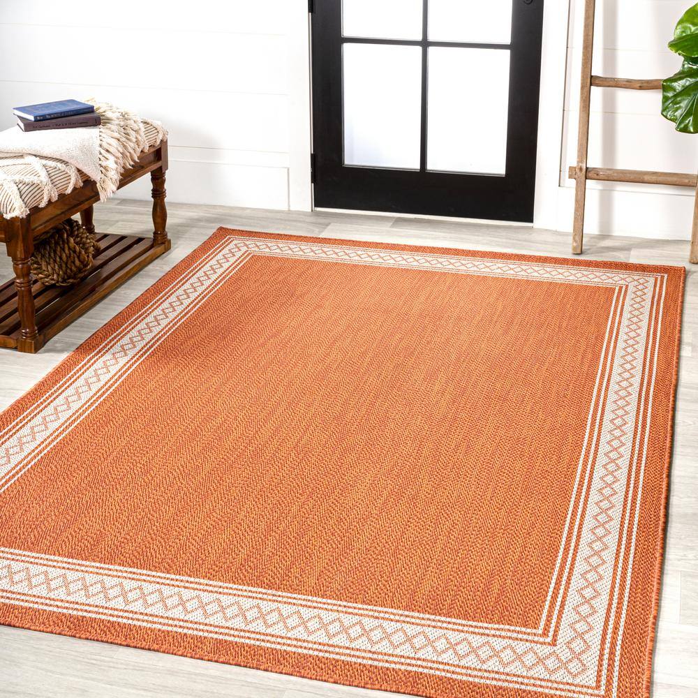 Lucia Cream and Orange Synthetic Indoor/Outdoor Area Rug