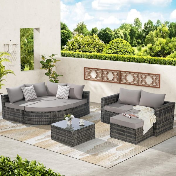 8-Piece Wicker L-Shaped Patio Conversation Set with Light Gray Cushions and Ottoman and Glass Top Table for Backyard
