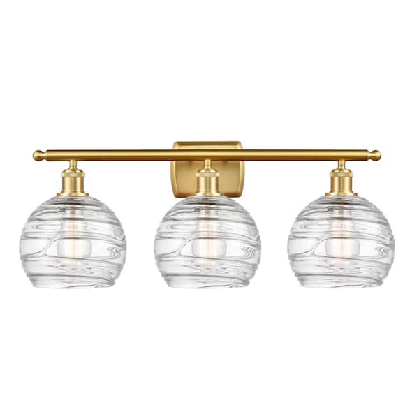 Athens Deco Swirl 26 in. 3-Light Clear Deco Swirl, Satin Gold Vanity Light with Clear Glass Shade