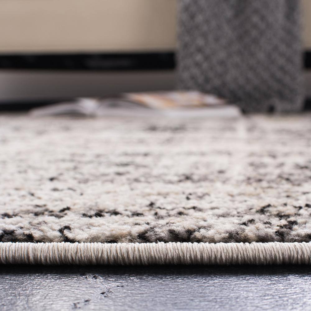 Silver and Black 6' x 9' Synthetic Rectangular Area Rug
