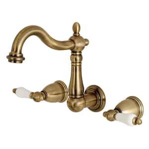 Heritage 2-Handle Wall Mount Bathroom Faucet in Antique Brass