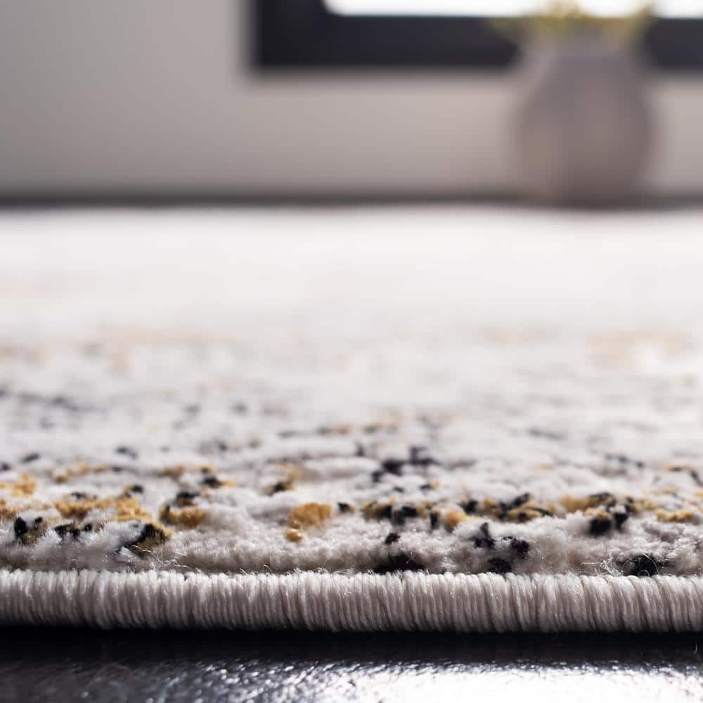 Cream and Gold Abstract 4' x 6' Stain-Resistant Area Rug