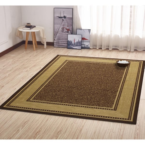 https://images.thdstatic.com/productImages/e1492019-bd95-4240-8ec7-f69216eb442f/svn/2208-dark-brown-ottomanson-area-rugs-oth2208-3x5-40_600.jpg