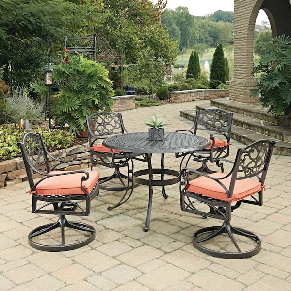 HOMESTYLES Sanibel 42 in. Swivel Rust Bronze 5-Piece Cast Aluminum Round Outdoor Dining Set with Coral Cushions