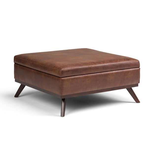 Simpli Home Owen 36 in. Wide Mid Century Modern Square Coffee Table Storage Ottoman in Distressed Saddle Brown Vegan Faux Leather