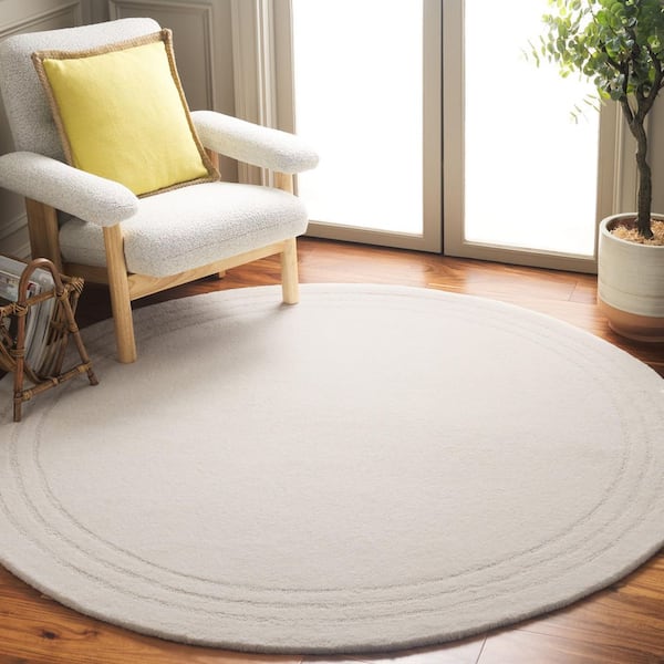 Metro 6 ft. x 6 ft. Ivory Solid Border Round Area Rug