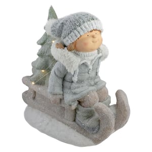 15 in. Beige and Green Lighted Girl on a SLED Christmas Decoration