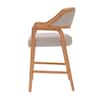 A single wooden counter stool with beige upholstery, showing the curved back.