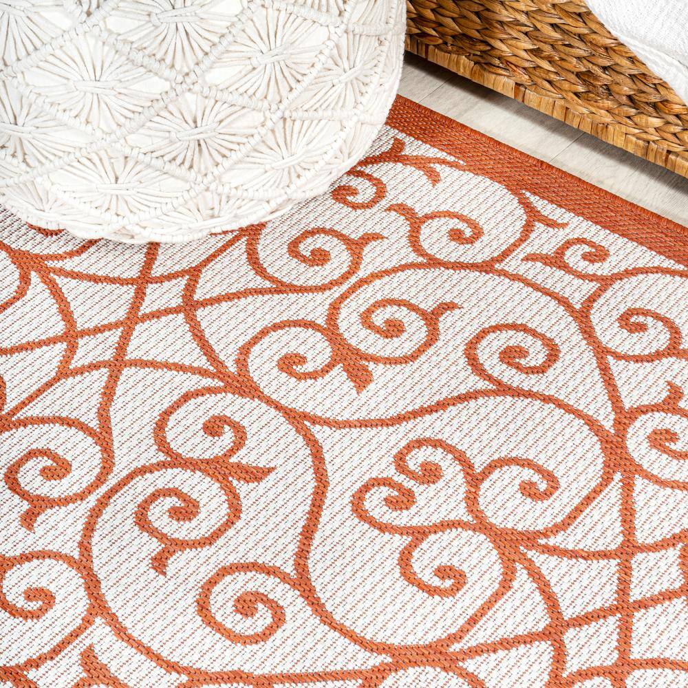 Cream and Orange 8' x 10' Synthetic Flat Woven Reversible Rug