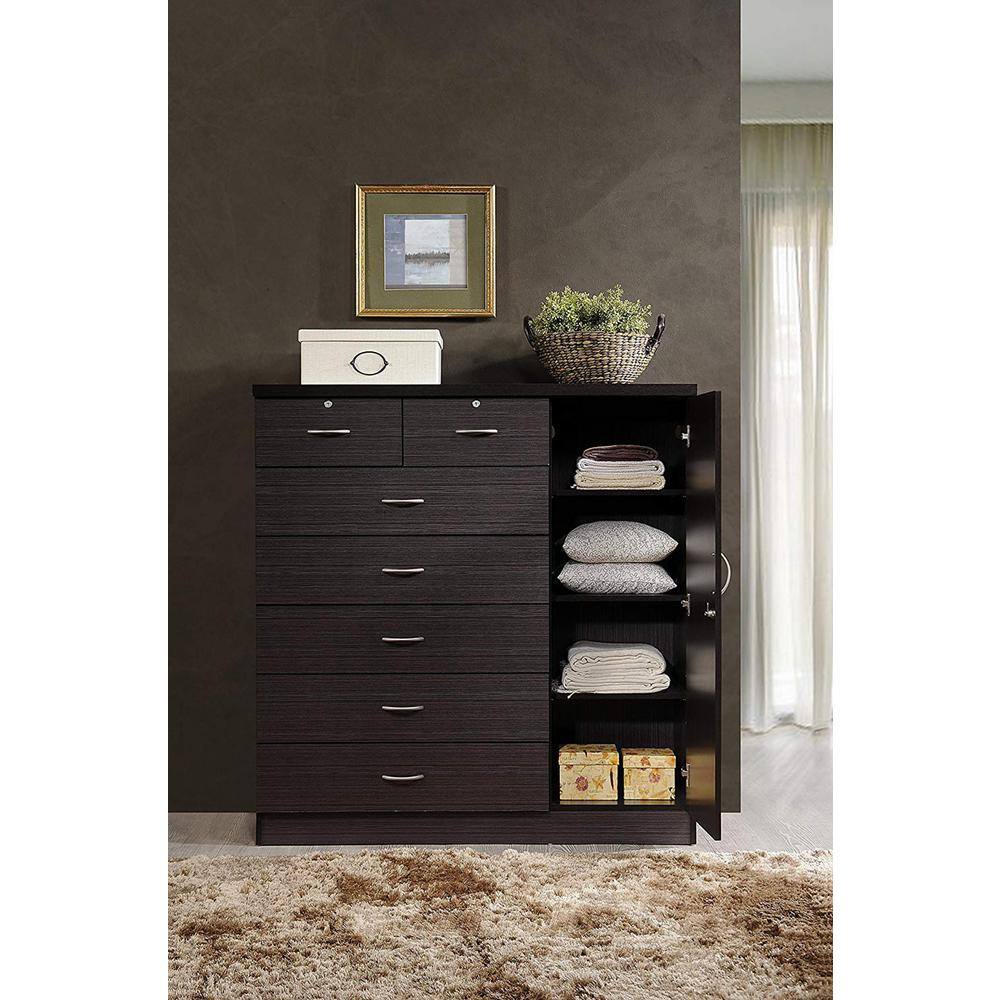 Black chest of drawers with open side door showing storage.