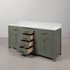 Glacial green double sink bathroom vanity with drawers pulled out.