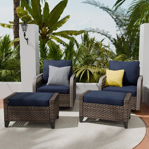 4-Piece Brown Wicker Outdoor Patio Conversation Set Swivel Rocking Chairs with Blue Cushions and Ottomans