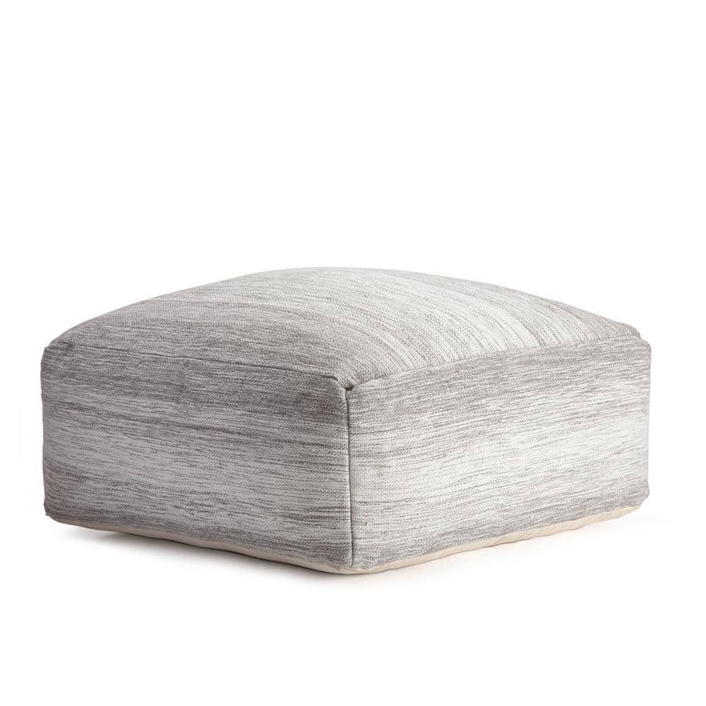 Three-quarter view of a gray and ivory square ottoman.