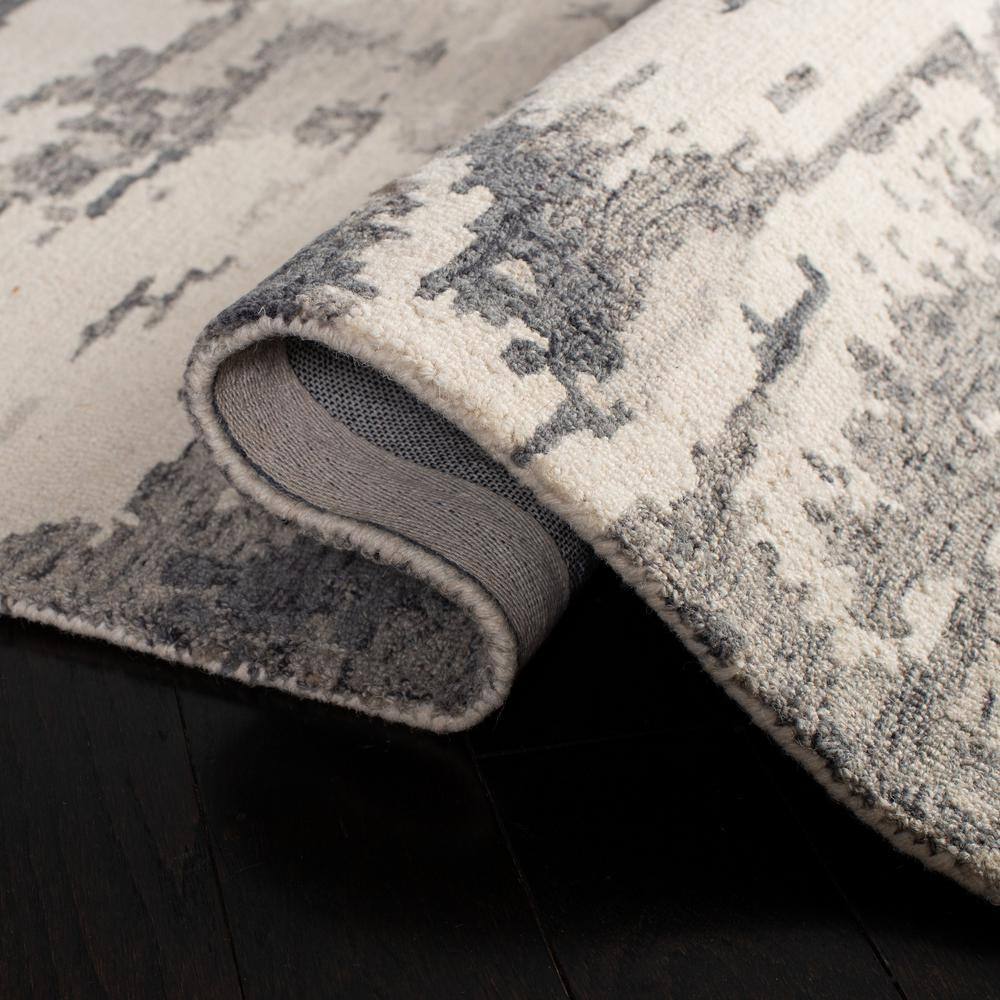 Handmade Charcoal and Ivory Wool 9' x 12' Abstract Tufted Rug