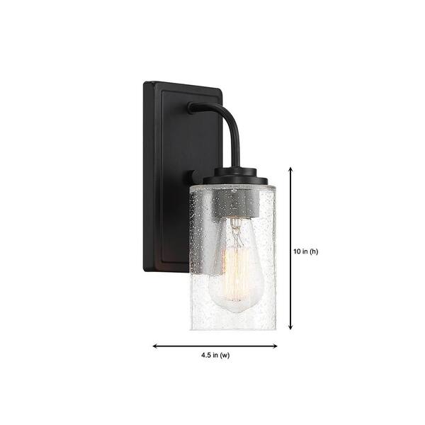 Designers Fountain - Logan 4.5 in. 1-Light Matte Black Transitional Wall Sconce with Clear Seedy Glass Shade